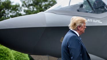 US President Donald Trump stands with an F-35 on the South Lawn of the White House during an event to showcase American made products at the White House July 23, 2018 in Washington, DC. (AFP)