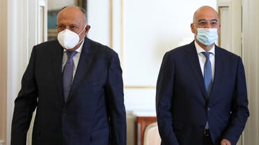 Greek Foreign Minister Nikos Dendias and his Egyptian counterpart Sameh Shoukry arrive to make a joint statement at the Foreign Ministry, in Athens, Greece September 15, 2020. REUTERS/Costas Baltas