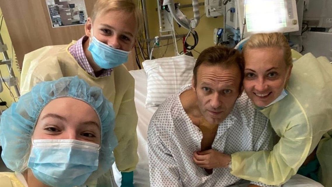 This handout picture posted on September 15, 2020 on the Instagram account of @navalny shows Russian opposition leader Alexei Navalny posing for a selfie picture with his family at Berlin's Charite hospital. 
