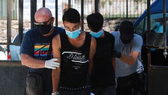 Greece jails Afghan teenagers for refugee camp fire