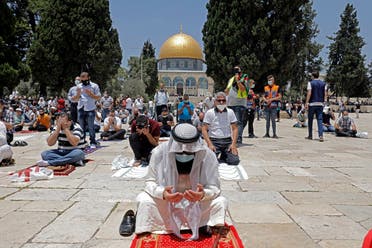 Palestinians perform the Friday prayer outside Jerusalem’s Al-Aqsa mosque compound, Islam’s third holiest site, amid the novel coronavirus pandemic crisis on July 10, 2020. (File photo: AFP)
