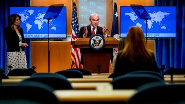 Elliott Abrams, accompanied by State Department spokeswoman Morgan Ortagus, speaks during a news conference at the State Department. (Reuters)