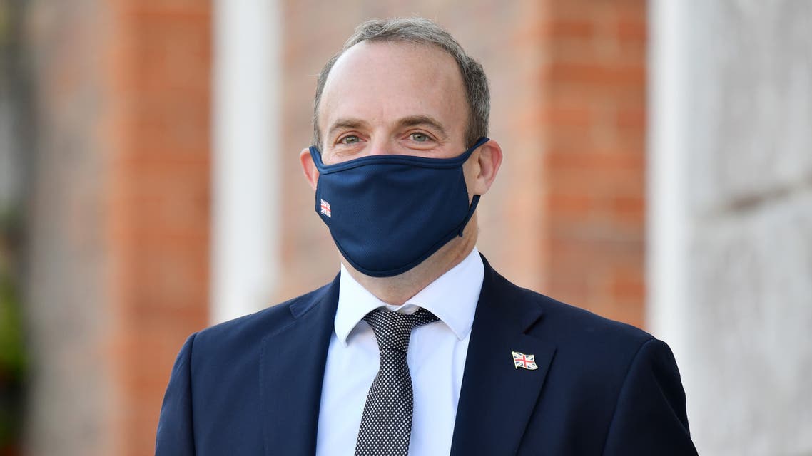 Britain's Foreign Secretary Dominic Raab wearing a protective face mask, waits to greet E3 foreign ministers at Chevening House, Sevenoaks, south of London, on September 10, 2020. The E3 foreign ministers met at the Foreign Secretary's country residence Chevening House.