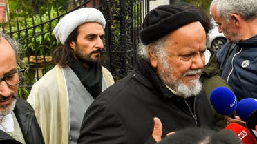 Founder of the Centre Zahra France religious association Gouasmi Yahia (R), flanked by Tahiri Jamel (L), head of the Centre, speaks to journalists, October 2, 2018. (AFP)