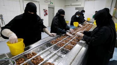 Saudi women work at a dates packaging factory in Al-Ahsa, Saudi Arabia. (Reuters)
