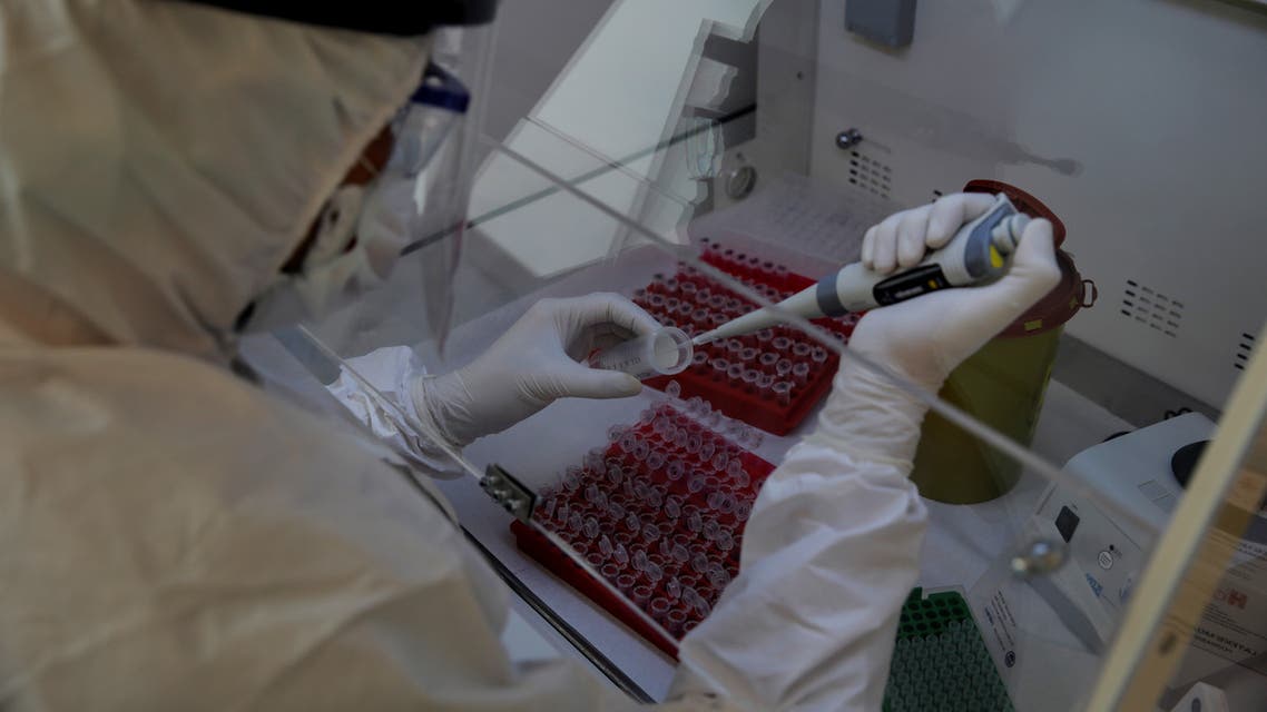 A biologist works on samples from test tubes to check if any of them tested positive for coronavirus disease (COVID-19) at the laboratory of Medicana International Hospital in Istanbul, Turkey, April 14, 2020. Picture taken April 14, 2020. REUTERS/Umit Bektas