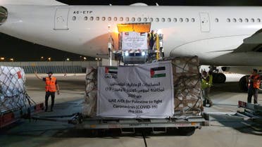 A cargo plane operated by Abu Dhabi's Etihad Airways offloads aid related to the coronavirus disease (COVID-19) for Palestinians at Ben Gurion airport on May 19, 2020. (Reuters)