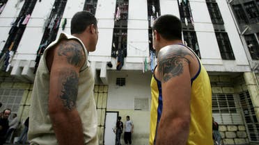 Lebanese priosners stroll inisde Roumieh prison, northeast of Beirut on April 7, 2006. (AFP)