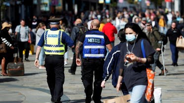A street ranger and a police community support officer patrol Northumberland Street amid the spread of the coronavirus disease (COVID-19), in Newcastle, Britain, on September 18, 2020. (Reuters)