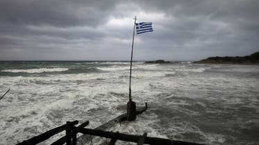 A Greek flag flatters in a beach near the town of Kyllini, as rare storm, known as a Medicane (Mediterranean hurricane), hit western Greece, September 18, 2020. (Reuters)