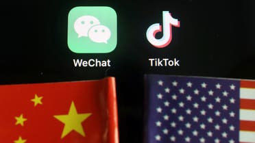 The messenger app WeChat and short-video app TikTok are seen near China and U.S. flags in this illustration picture taken August 7, 2020. (Reuters)
