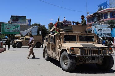 Afghan security forces sit in a Humvee vehicle amid ongoing fighting between Taliban militants and Afghan security forces in Kunduz on May 19, 2020. (AFP)