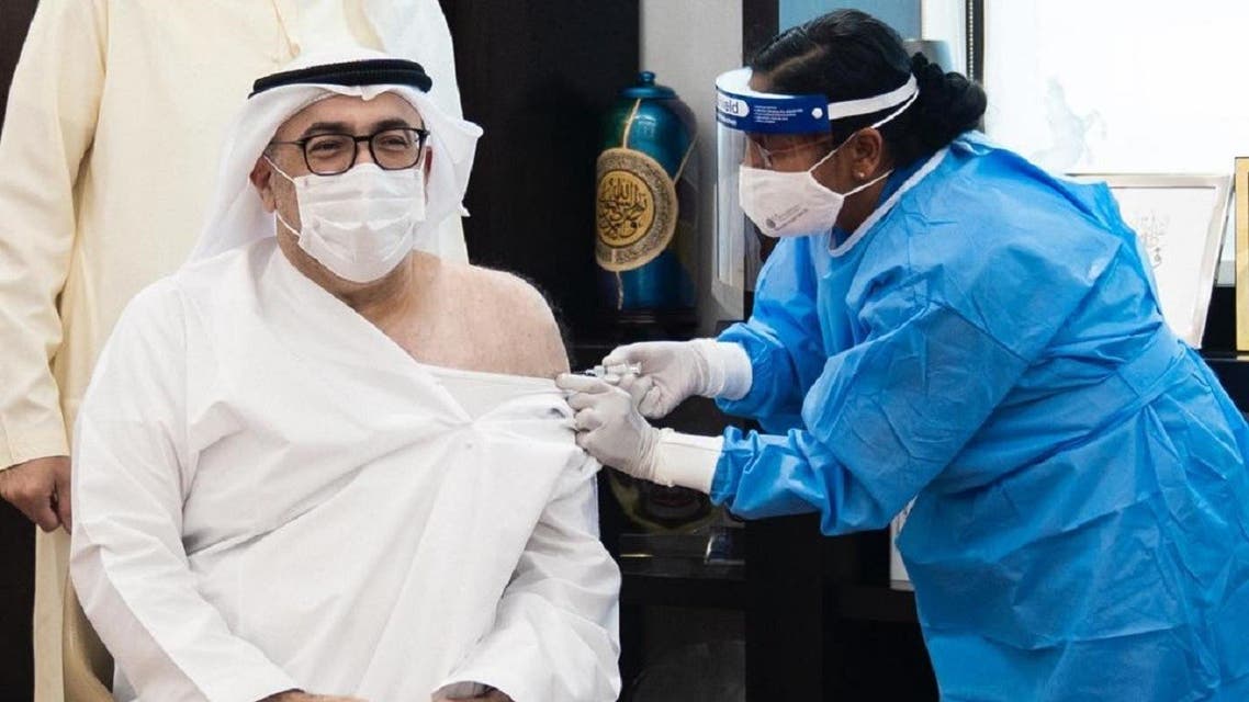 UAE's Minister of Health and Prevention Abdul Rahman al-Owais takes the first COVID-19 vaccine dose. (WAM)