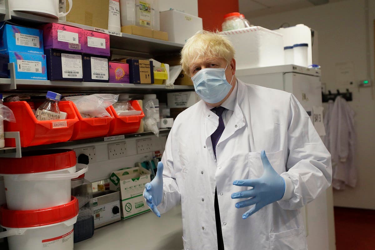 UK’s PM Johnson during a visit to the Jenner Institute in Oxford, central England, on September 18, 2020, where he met scientists who are leading the covid-19 vaccine research. (AFP)