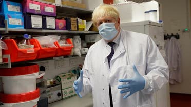UK’s PM Johnson during a visit to the Jenner Institute in Oxford, central England, on September 18, 2020, where he met scientists who are leading the covid-19 vaccine research. (AFP)