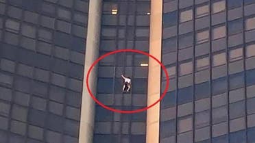 an ordinary man climbed on skyscraper