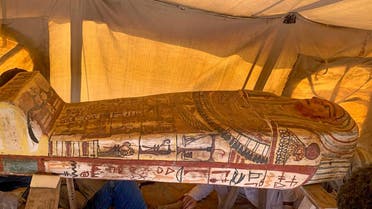 A handout picture released by the Egyptian Ministry of Antiquities on September 20, 2020, shows one of fourteen 2500 year-old coffins discovered in a burial shaft at the desert necropolis of Saqqara south of the capital. (AFP)