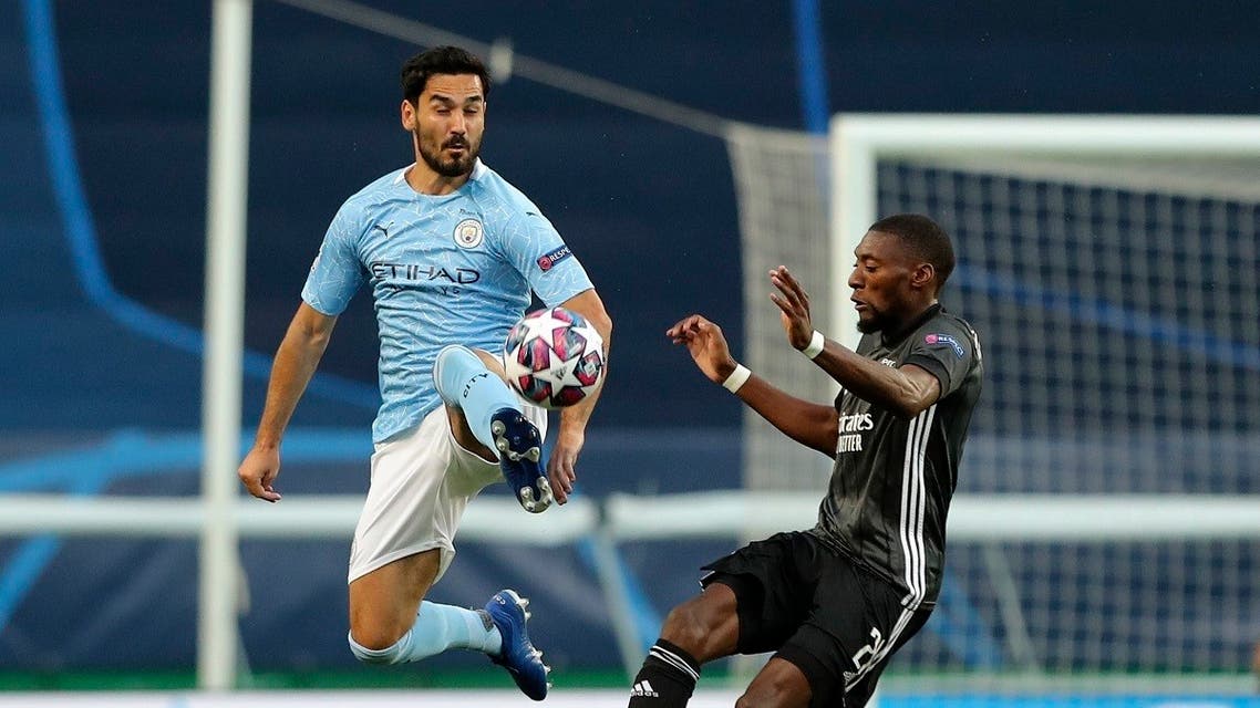 Manchester City's Ilkay Gundogan kicks the ball clear during the Champions League quarterfinal soccer match between Lyon and Manchester City at the Jose Alvalade stadium in Lisbon, Portugal, Saturday, Aug. 15, 2020. (Miguel A. Lopes/Pool via AP)