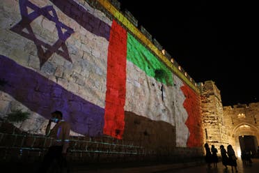The flags of Israel, United Arab Emirates, and Bahrain are projected on the ramparts of Jerusalem's Old City on September 15, 2020. (AFP)