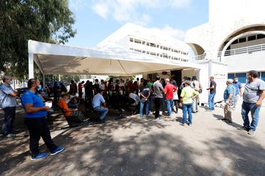 People wait for PCR tests Beirut Rafik Hariri University Hospital on August 25, 2020. (AFP)