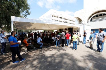 People wait for PCR tests Beirut Rafik Hariri University Hospital on August 25, 2020. (AFP)