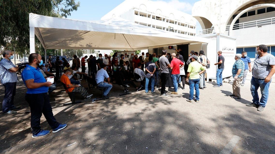 People wait for PCR tests Beirut Rafik Hariri University Hospital on August 25, 2020. (AFP)