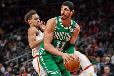  Boston Celtics center Enes Kanter (11) controls the ball against Atlanta Hawks guard Trae Young (left) on February 4, 2020. (Reuters)