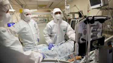 Hospital staff provide medical care for coronavirus patients in an Israeli hospital ward. (Reuters)
