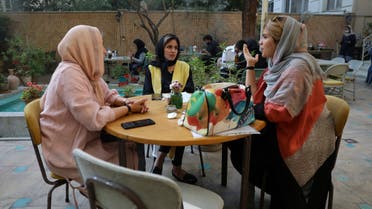 People spend their afternoon in a cafe in Tehran, Iran, Sunday, Sept. 20, 2020. (AP)