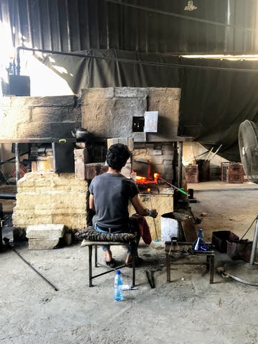 A member of the Khalifeh family in Sarafand, Lebanon works in the glass factory. (Supplied)