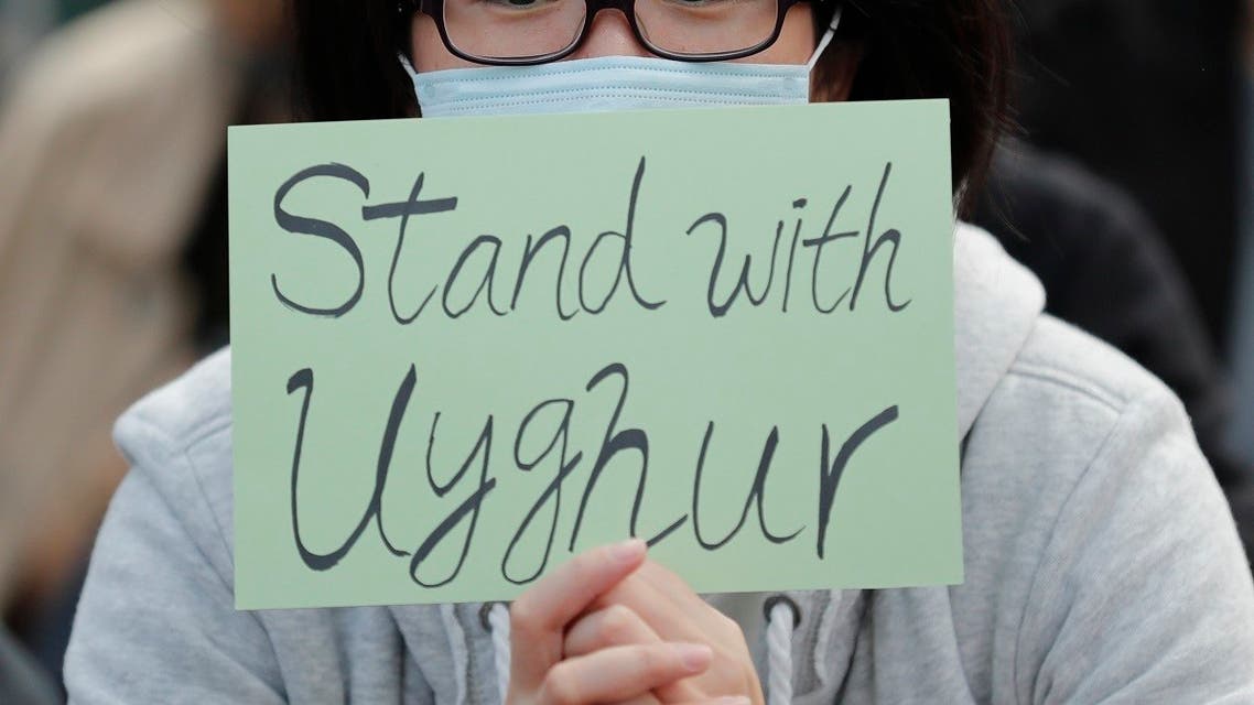 In this Dec. 22, 2019, file photo, a man holds a sign during a rally to show support for Uighurs and their fight for human rights in Hong Kong. (AP)