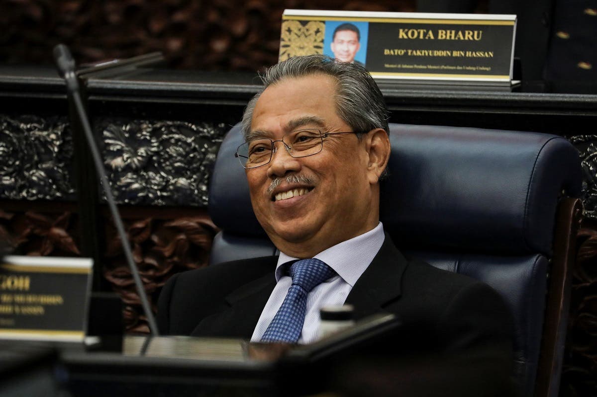 Malaysia’s Prime Minister Muhyiddin Yassin smiles during a session of the lower house of parliament, in Kuala Lumpur, Malaysia, on July 13, 2020. (Reuters)