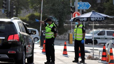 Israeli police check a car at a check point after Israel entered a second nationwide lockdown amid a resurgence in new coronavirus disease (COVID-19) cases, forcing residents to stay mostly at home during the Jewish high-holiday season, at the entrance to Jerusalem September 19, 2020. (Reuters)
