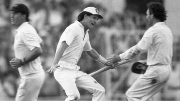 In this Nov. 8, 1987 file photo, Australian batsman Dean Jones holds the stumps as he races to embrace team captain Allan Border, right, in a moment of jubilation, in Calcutta, India. (AP)