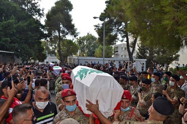 Lebanese soldiers carry the coffins of four comrades who were killed in the northern city of Tripoli, September 14, 2020. (AFP)