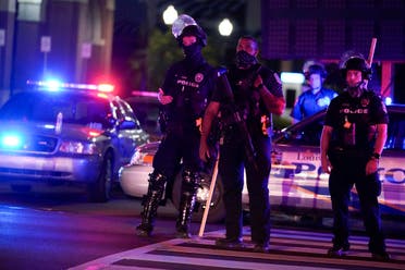 Police stand on the street moments before curfew, Thursday, Sept. 24, 2020, in Louisville, Ky. (AP)