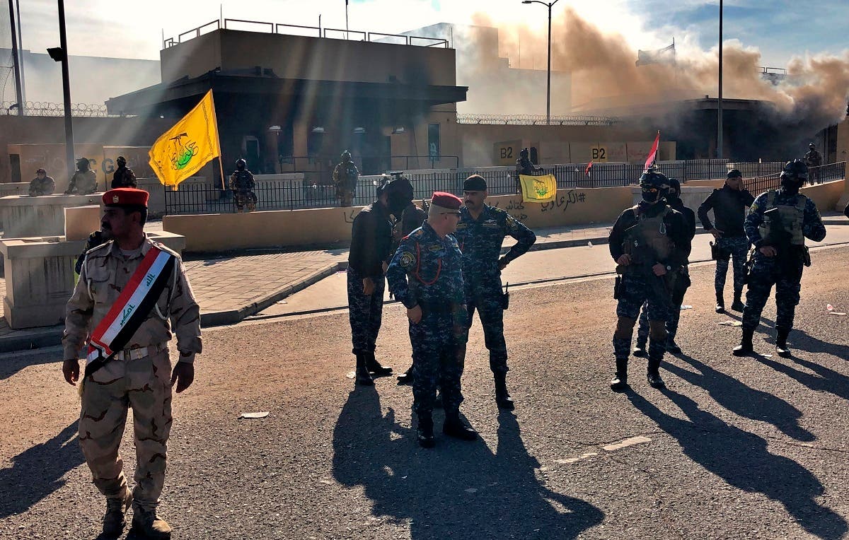 Iraqi security forces stand guard in front of the US Embassy in Baghdad, Iraq, Jan. 1, 2020. (AP)