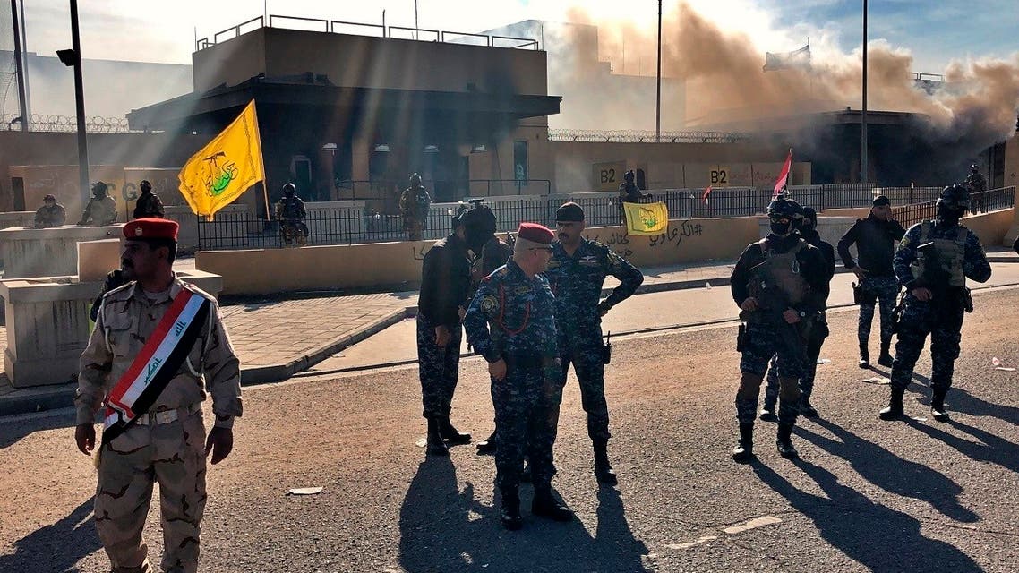 Iraqi security forces stand guard in front of the US Embassy in Baghdad, Iraq, Jan. 1, 2020. (AP)