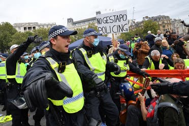 Police move in to disperse protesters in Trafalgar Square in London on September 26, 2020, at a 'We Do Not Consent!' mass rally against vaccination and government restrictions. (AFP)