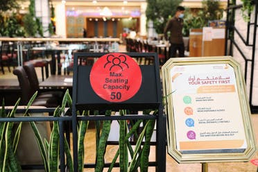A safety sign is seen at the entrance of a restaurant in Mall of the Emirates in Dubai. (File photo: Reuters)