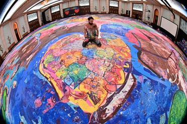 The painting, which measures the size of two football fields, can be seen at a hotel in Dubai, where Jafri spent months of lockdown due to the coronavirus pandemic. (AFP)