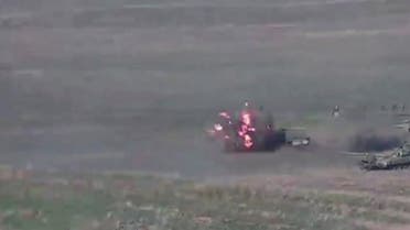 A still image from a video released by the Armenian Defence Ministry shows what is said to be Azerbaijani tanks, one of which is destroyed by Armenian armed forces in the breakaway region of Nagorno-Karabakh, in this still image from footage released September 27, 2020. (Reuters)