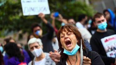 Demonstrators protest against the regional government’s measures to control the spread of the coronavirus at Vallecas neighborhood, in Madrid, Spain, September 27, 2020. (Reuters)