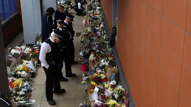 Police officers pay their respects at the custody centre where a British police officer has been shot dead in Croydon, south London, Britain, September 26, 2020. (Reuters)