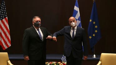 U.S. Secretary of State Mike Pompeo, left, and Greek Foreign Minister Nikos Dendias touch elbows during their meeting in the northern city of Thessaloniki, Greece, Monday, Sept. 28, 2020. (AP)