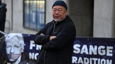 Chinese dissident artist Ai Weiwei stages a silent protest in support of Julian Assange outside of the Old Bailey court in central London on September 28, 2020. (AFP)