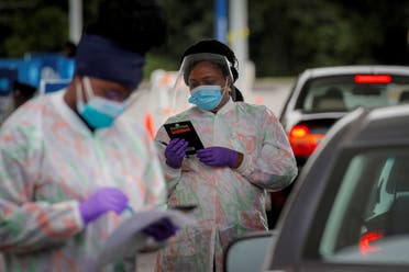 Medical technicians work at a drive-through coronavirus testing facility in New York, US September 17, 2020. (Reuters)