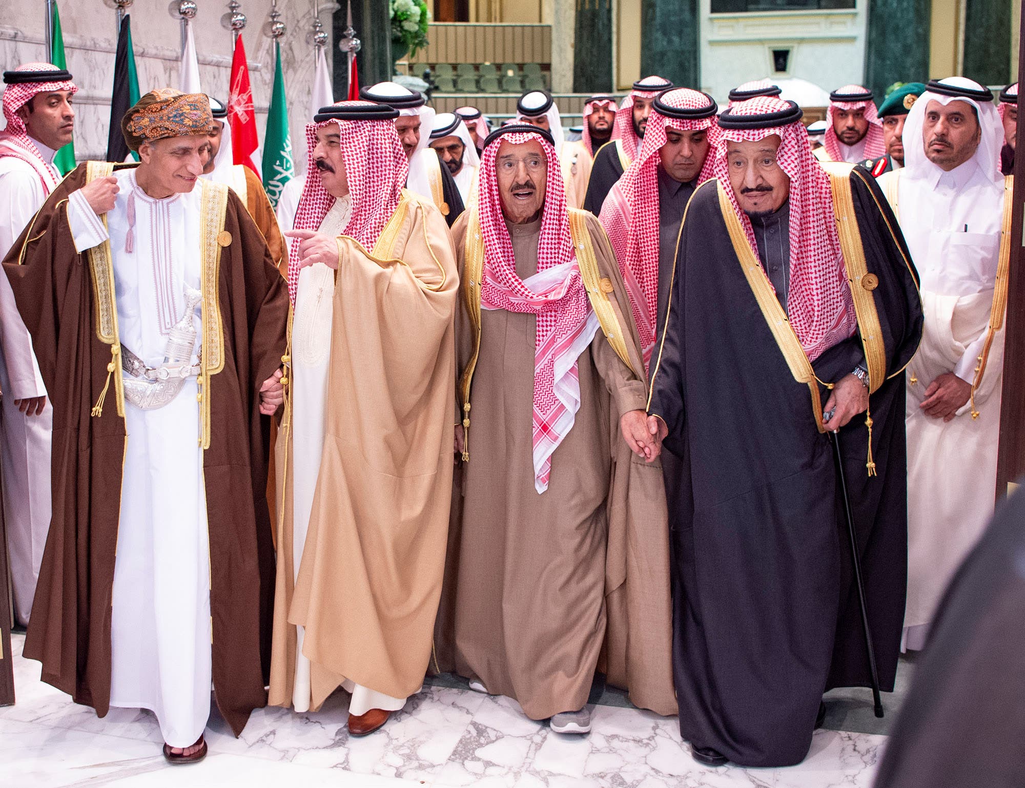 Saudi Arabia's King Salman bin Abdulaziz Al Saud walks with Kuwaiti Emir Sheikh Sabah al-Ahmad al-Jaber al-Sabah and GCC leaders during the Gulf Cooperation Council's (GCC) 40th Summit in Riyadh. (Reuters)