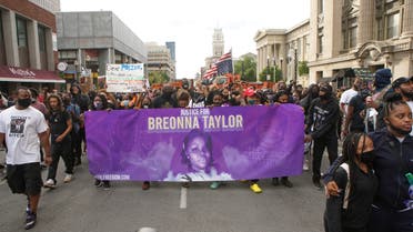 Protesters march through downtown Louisville after a grand jury decided not to bring homicide charges against police officers involved in the fatal shooting of Breonna Taylor, in Louisville, Kentucky September 25, 2020. (Reuters)