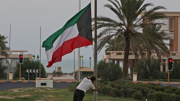 The Kuwaiti flag is lowered to half-mast outside the Dasman Diabetes Institute in Kuwait City on September 29, 2020, as the country mourns the death of emir Sheikh Sabah al-Ahmad Al-Sabah. (AFP)